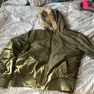 Green puffer jacket.